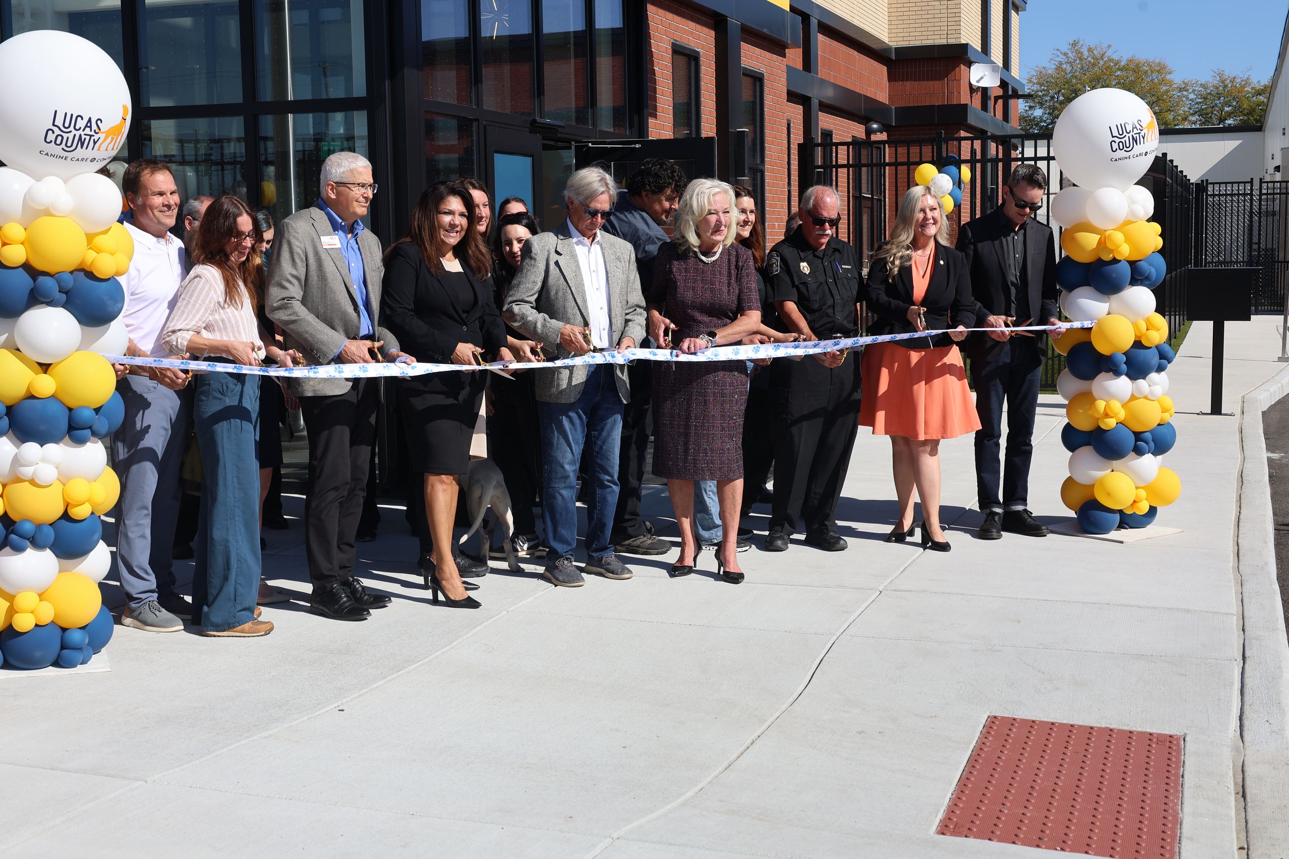 Lucas County Commissioners and partners cut the ribbon to the new Lucas County Canine Care & Control